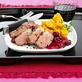 Sliced duck breast with cherries & mashed sweet potatoes