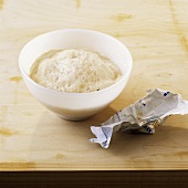 Mixing crumbled yeast with water