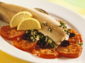 Steamed trout with spinach and tomatoes
