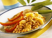 Turkey breast on lentils and pineapple with strips of pepper