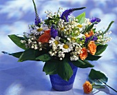 Colourful bouquet with lilies of the valley