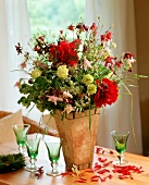 Bouquet of red peonies, aquilegia and grasses