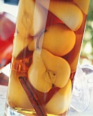 Pears preserved in schnapps with cinnamon sticks