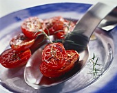 Grilled tomato halves with rosemary