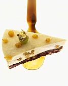 Piece of chocolate and vanilla gateau on mother-of-pearl spoon