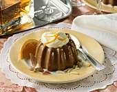 Turned-out chocolate blancmange with almonds and orange cream