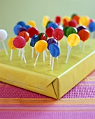 Gift decorated with coloured lollipops