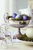 Coloured Easter eggs in a silver bowl