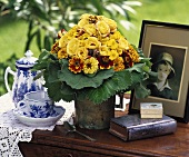 Small bouquet in yellow, old picture, coffee set