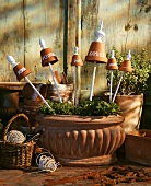 Terracotta bowl of terracotta pots as name labels for herbs