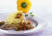 Veal escalope with pepper sauce and pasta