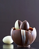 Chocolate mousse in chocolate shell with chocolate eggs