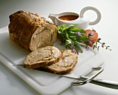 Roast veal roll with tomato sauce