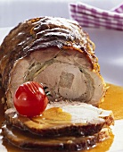 Rolled roast with onion stuffing, partly sliced