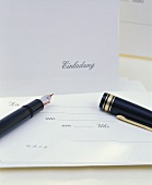 Printed invitation and elegant fountain pen