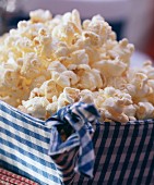 Popcorn in a blue and white cloth basket