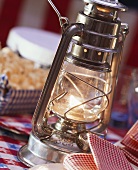 One hurricane lamp as table lighting at American snack party