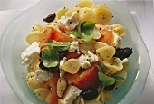 Greek pasta salad with tomatoes, sheep's cheese & olives