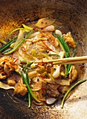 Spicy chicken thighs with spring onions and chilis