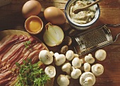 Bacon slices, eggs, onion, mushrooms, nutmegs & lard