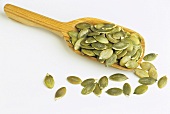 Many Sunflower Seeds in Wooden Scoop