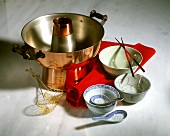Fondue pot, fondue baskets, bowls, chopsticks and spoon