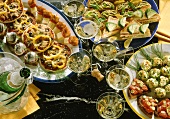 Many different snacks and full champagne glasses