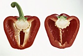 Two red pepper halves, with and without stalk