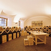 Wine merchants with wine bottles in racks and crates