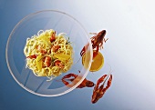 Spaghetti with crayfish & orange segments in orange butter