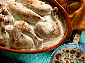 Baked chicken with yoghurt sauce in baking dish