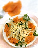 Noodles with salmon, cream sauce and herbs