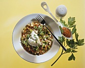 Lentil risotto with vegetables, sour cream and chopped parsley