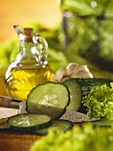 Fresh cucumber, cut into, with drops of water & knife