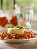 Egg & cheese flan on tomato salad with rocket