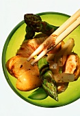 Vegetable stir-fry with turkey, coconut in bowl with chopstick