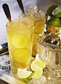 Cold punch (Kalte Ente) with lemon & crushed ice in glasses
