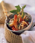 Seafood with mint, peppers and chives in bowl