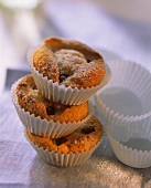 Cherry muffins with icing sugar in paper cases