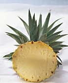 Pineapple with leaves, cut through the middle
