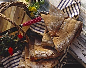 Tyrolean rye bread, cut into triangle, on cloth