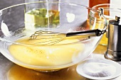 Vinaigrette in a bowl with whisk