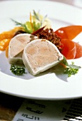 Goose liver pate garnished with lettuce, tomatoes & oranges