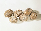 Nutmegs on light background