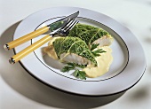 Fish parcels (cod in savoy) with hollandaise sauce