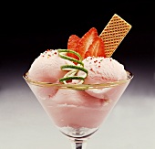 Strawberry sundae with strawberries, lime zest and wafer