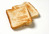 Two slices of toast on a light background