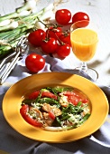 Spinach stew with chicken & tomatoes on plate; orange juice