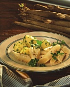 Parsley potatoes with scorzonera on plate