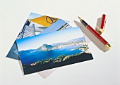 Three different picture postcards and fountain pen